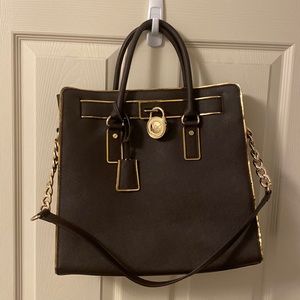 Worn a few times kept in closet. Rough size is 17.5"W X 12.75"H X 5.5"D